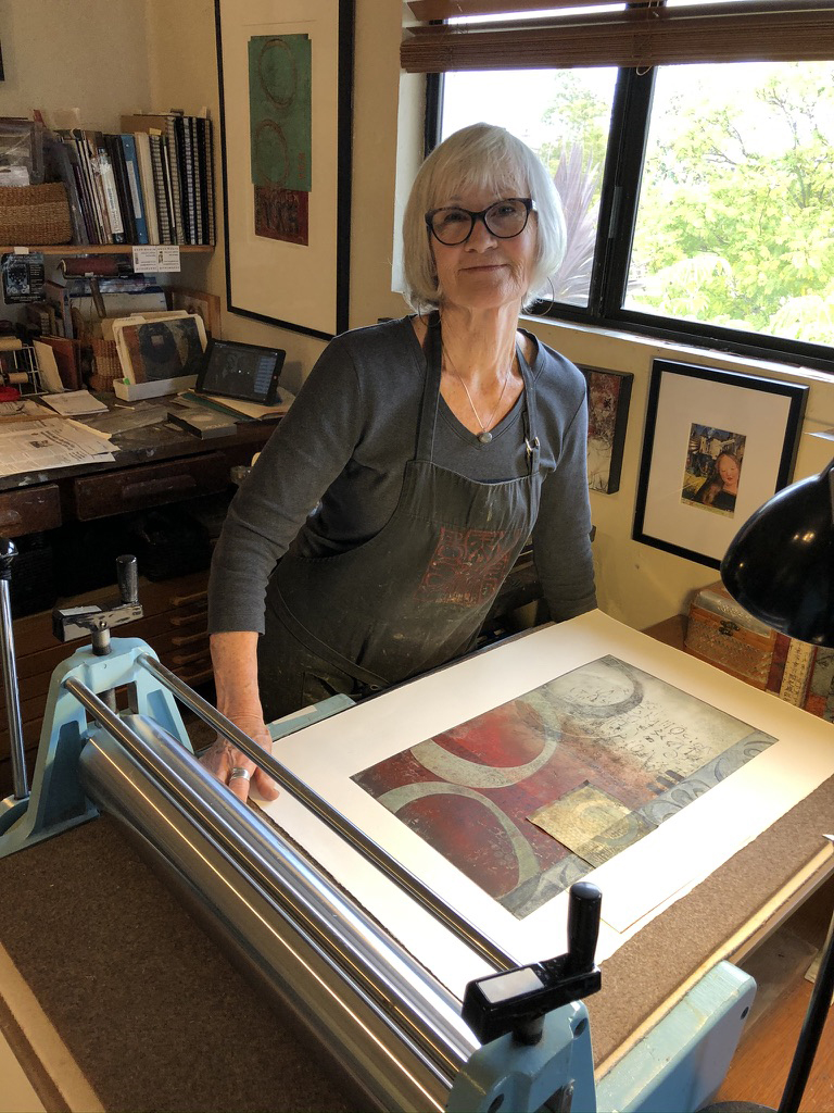 Anne, printmaker at press